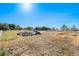 Landscaped backyard with garden and white fence at 9508 E 147Th Ave, Brighton, CO 80602