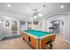 Basement game room with pool table and basketball game at 9508 E 147Th Ave, Brighton, CO 80602