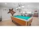 Basement game room with pool table and bar area at 9508 E 147Th Ave, Brighton, CO 80602