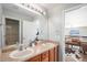 Bathroom with double sinks, mirror, and a bathtub at 9508 E 147Th Ave, Brighton, CO 80602