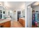 Bathroom with double sinks, walk-in shower, and large closet at 9508 E 147Th Ave, Brighton, CO 80602