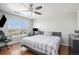 Bedroom with large bed, window, and home office space at 9508 E 147Th Ave, Brighton, CO 80602