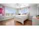 Bright bedroom with a queen-size bed and window seat at 9508 E 147Th Ave, Brighton, CO 80602