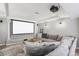 Home theatre with sectional sofa and projector at 9508 E 147Th Ave, Brighton, CO 80602