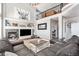 Two-story living room with fireplace and built-in shelving at 9508 E 147Th Ave, Brighton, CO 80602