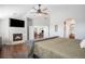 Main bedroom with fireplace and access to additional living space at 9508 E 147Th Ave, Brighton, CO 80602