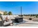 Relaxing patio furniture with fire pit and mountain views at 9508 E 147Th Ave, Brighton, CO 80602