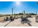 Outdoor patio with string lights, hot tub, and dining area at 9508 E 147Th Ave, Brighton, CO 80602