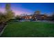 Large backyard with deck, playset, and grassy area at 13413 W 21St Ave, Golden, CO 80401