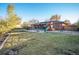 Large backyard with a deck, playground, and plenty of grass at 13413 W 21St Ave, Golden, CO 80401