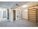 Unfinished basement with built-in shelving and stairs at 13413 W 21St Ave, Golden, CO 80401