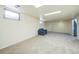 Spacious finished basement with a couch and access to the stairs at 13413 W 21St Ave, Golden, CO 80401