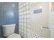 Modern bathroom with glass block wall and walk-in shower at 13413 W 21St Ave, Golden, CO 80401