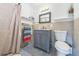 Updated bathroom with gray vanity and patterned tile floor at 13413 W 21St Ave, Golden, CO 80401