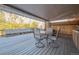 Covered deck with table and chairs, perfect for outdoor dining at 13413 W 21St Ave, Golden, CO 80401