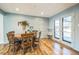 Dining area with wood table and chairs, near kitchen and backyard access at 13413 W 21St Ave, Golden, CO 80401