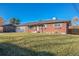 Charming ranch-style home with brick exterior and a well-maintained lawn at 13413 W 21St Ave, Golden, CO 80401