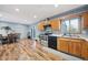Eat-in kitchen with stainless steel appliances and wood flooring at 13413 W 21St Ave, Golden, CO 80401
