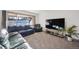 Spacious living room with large window, comfortable seating, and a flat-screen TV at 13413 W 21St Ave, Golden, CO 80401