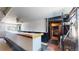 View of bar area with kitchen and storage in the background at 480 N 6Th Ave, Brighton, CO 80601