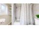 Updated bathroom with a tub and shower, built-in shelving at 480 N 6Th Ave, Brighton, CO 80601