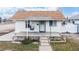 Charming bungalow with a front porch and well-maintained landscaping at 480 N 6Th Ave, Brighton, CO 80601