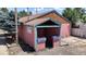 Front view of pink commercial building for lease at 480 N 6Th Ave, Brighton, CO 80601