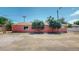 Pink commercial building exterior for lease; ample parking available at 480 N 6Th Ave, Brighton, CO 80601