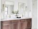 Modern bathroom with double vanity, marble countertops, and gold fixtures at 1465 Cook St, Denver, CO 80206