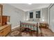 Simple bedroom with wood floors, patterned bedding, and motivational wall art at 8311 S Mariposa Dr, Morrison, CO 80465