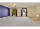 Living room with carpet, ceiling fan, and staircase at 12206 W Quinn Dr, Morrison, CO 80465