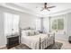 Spacious Primary bedroom with a king-size bed and en-suite bathroom at 15373 E 113Th Pl, Commerce City, CO 80022