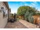 Private backyard with patio, mature trees, and plenty of space for outdoor entertaining at 15373 E 113Th Pl, Commerce City, CO 80022