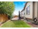 Cozy patio with pavers, seating area, and umbrella at 15373 E 113Th Pl, Commerce City, CO 80022