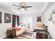 Basement bedroom with two twin beds, ample closet space, and ceiling fan at 15373 E 113Th Pl, Commerce City, CO 80022