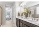 Bathroom with double vanity, and view of bedroom and additional bathroom at 15373 E 113Th Pl, Commerce City, CO 80022