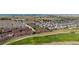 Large community view with many houses and a golf course at 15373 E 113Th Pl, Commerce City, CO 80022