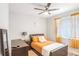 Cozy bedroom with a queen bed and large window at 15373 E 113Th Pl, Commerce City, CO 80022