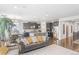 Open living room with hardwood floors, and a view of kitchen at 15373 E 113Th Pl, Commerce City, CO 80022