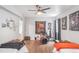 Basement bedroom with two twin beds and a dedicated workspace at 15373 E 113Th Pl, Commerce City, CO 80022