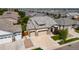 Aerial view of a two-story house with a large yard and two-car garage in a neighborhood at 15373 E 113Th Pl, Commerce City, CO 80022