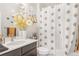 Clean bathroom with shower/tub combo and updated vanity at 15373 E 113Th Pl, Commerce City, CO 80022
