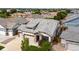 Aerial view of a house with a two car garage and landscaped yard at 15373 E 113Th Pl, Commerce City, CO 80022