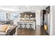 Modern kitchen with dark cabinets, granite counters, and an island at 15373 E 113Th Pl, Commerce City, CO 80022