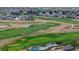 Golf course with several homes surrounding it at 15373 E 113Th Pl, Commerce City, CO 80022