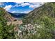 Aerial view of town nestled in mountain valley at 2115 Hummingbird Way # 102, Georgetown, CO 80444