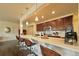 Modern kitchen with dark cabinets, white countertops, and stainless steel appliances at 14595 Vancouver Pl, Parker, CO 80134