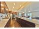 Modern kitchen with stainless steel appliances and an island with seating at 14595 Vancouver Pl, Parker, CO 80134