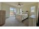 Bright bedroom with sliding door to patio access at 14595 Vancouver Pl, Parker, CO 80134