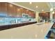 Kitchen with dark wood cabinets and white quartz countertops at 14595 Vancouver Pl, Parker, CO 80134